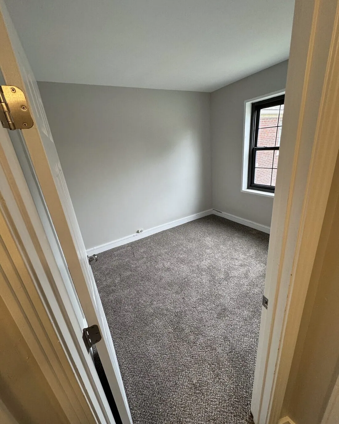 Bedroom with fresh carpet and paint
