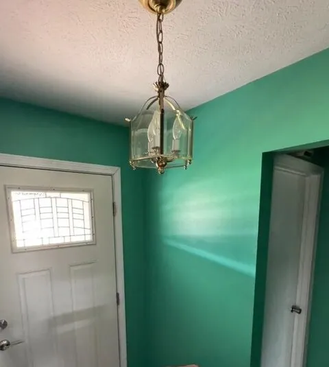 Entryway before — dated brass fixture